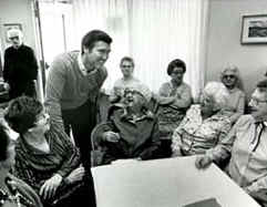 Cohen talking with senior citizens