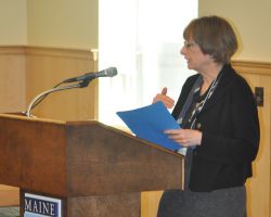 Joyce Rumery welcomes the audience to the 2010 Forum