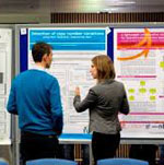two people viewing poster presentations