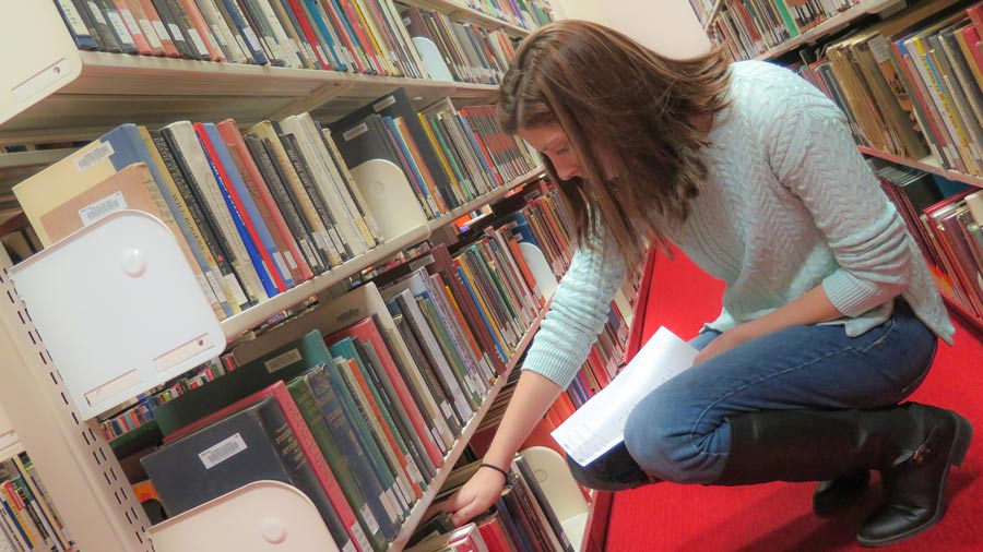 work-study student shelving books