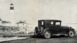 An automobile parked near Portland Head lighthouse, circa 1929.
