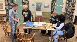 Four members of Beryl Warner Williams' family visiting Special Collections