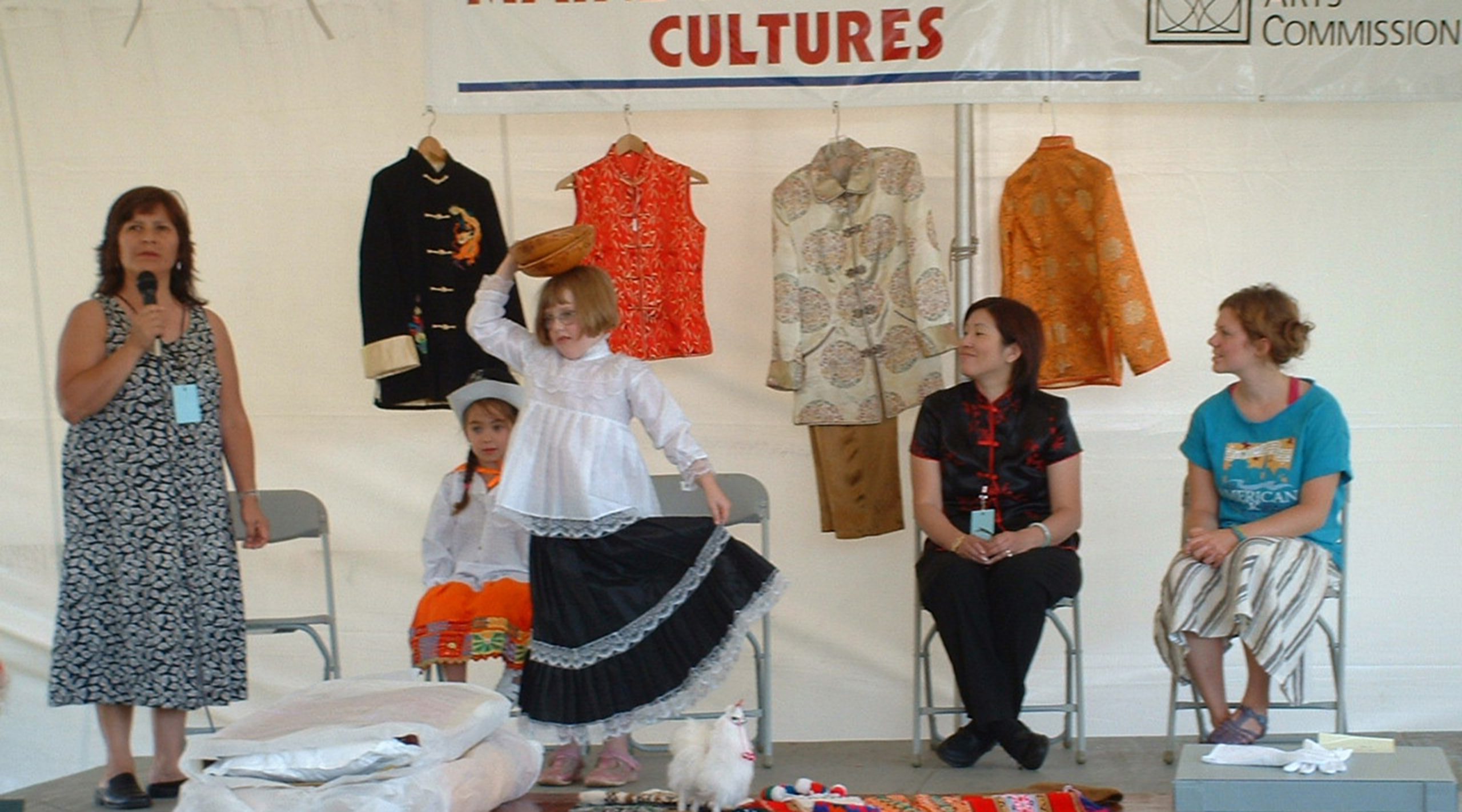 Festival participants displaying clothing of Peru. China, Sweden, Hungary, and Pakistan at the Folk and Traditional Arts Stage at the American Folk Festival in Bangor in 2005.