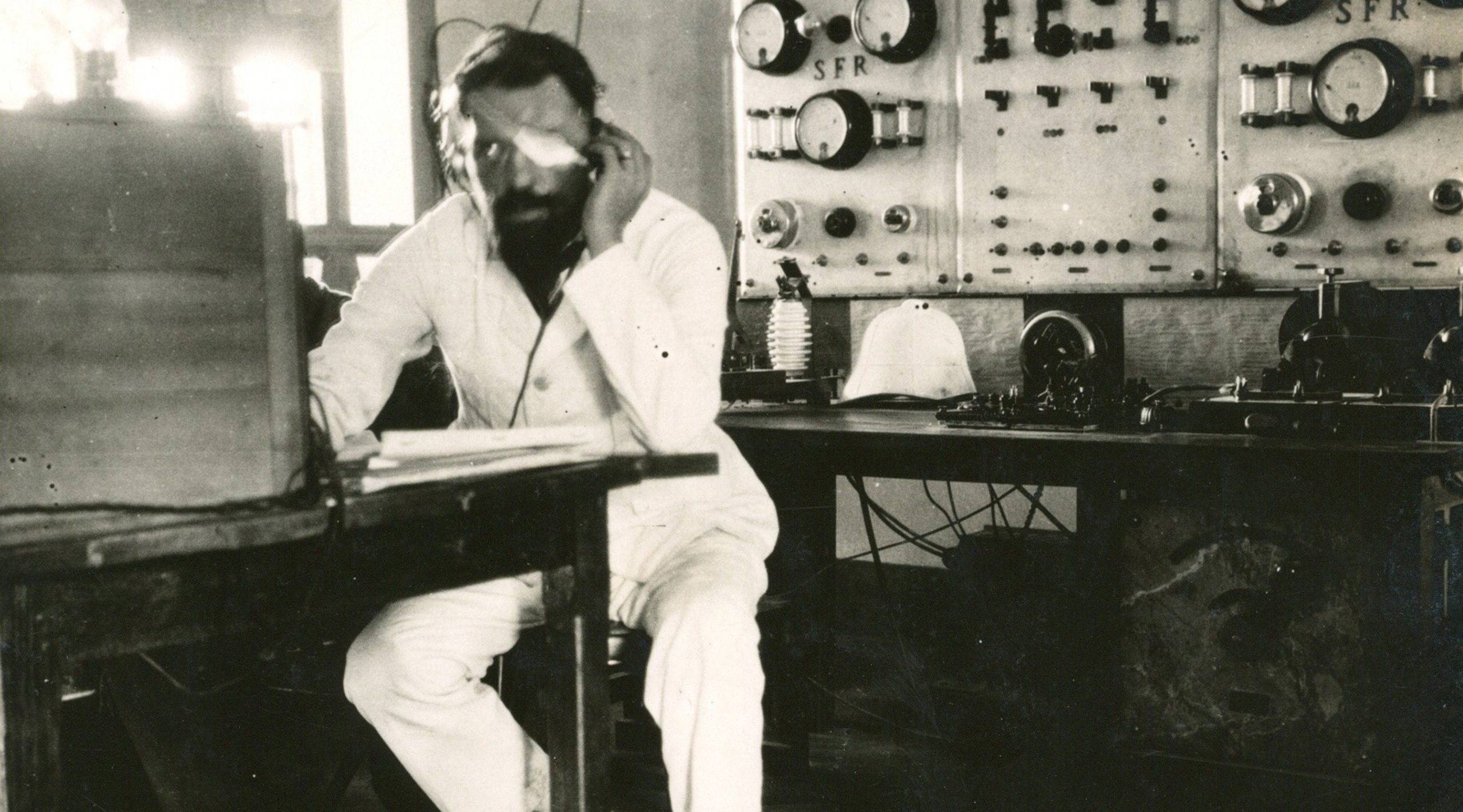 Floyd Gibbons listening at a radio terminal in Mali in 1923.